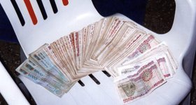 The largest note (5000 Cedis) was worth less than $5. So you carried a lot of cash that wasn't worth a lot.