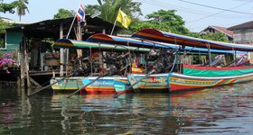 Long tail boats - all equipped with an ancient V8 engine from a long-dead car.
