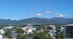 Cairns. To say it Aussie-style, say "cans" with a very nasal accent.