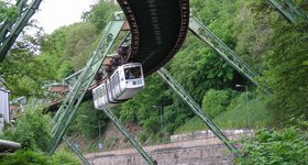 It's the famous Wuppertal Schwebebahn (suspension railway) in action - opened in 1901 and still operating