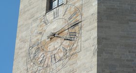Clock over a sundial